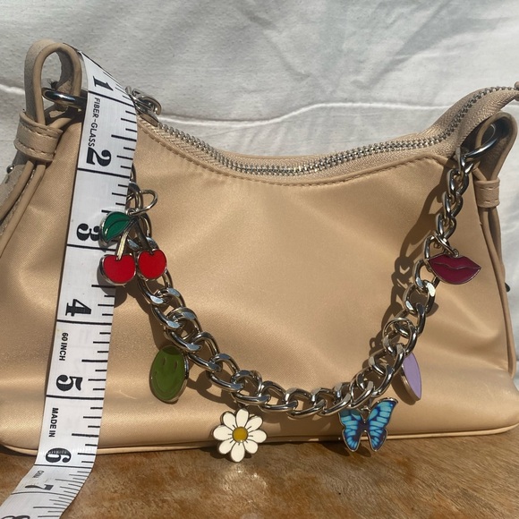 Small Madden NYC oatmilk bag with a silver zipper and charms - Picture 3 of 6